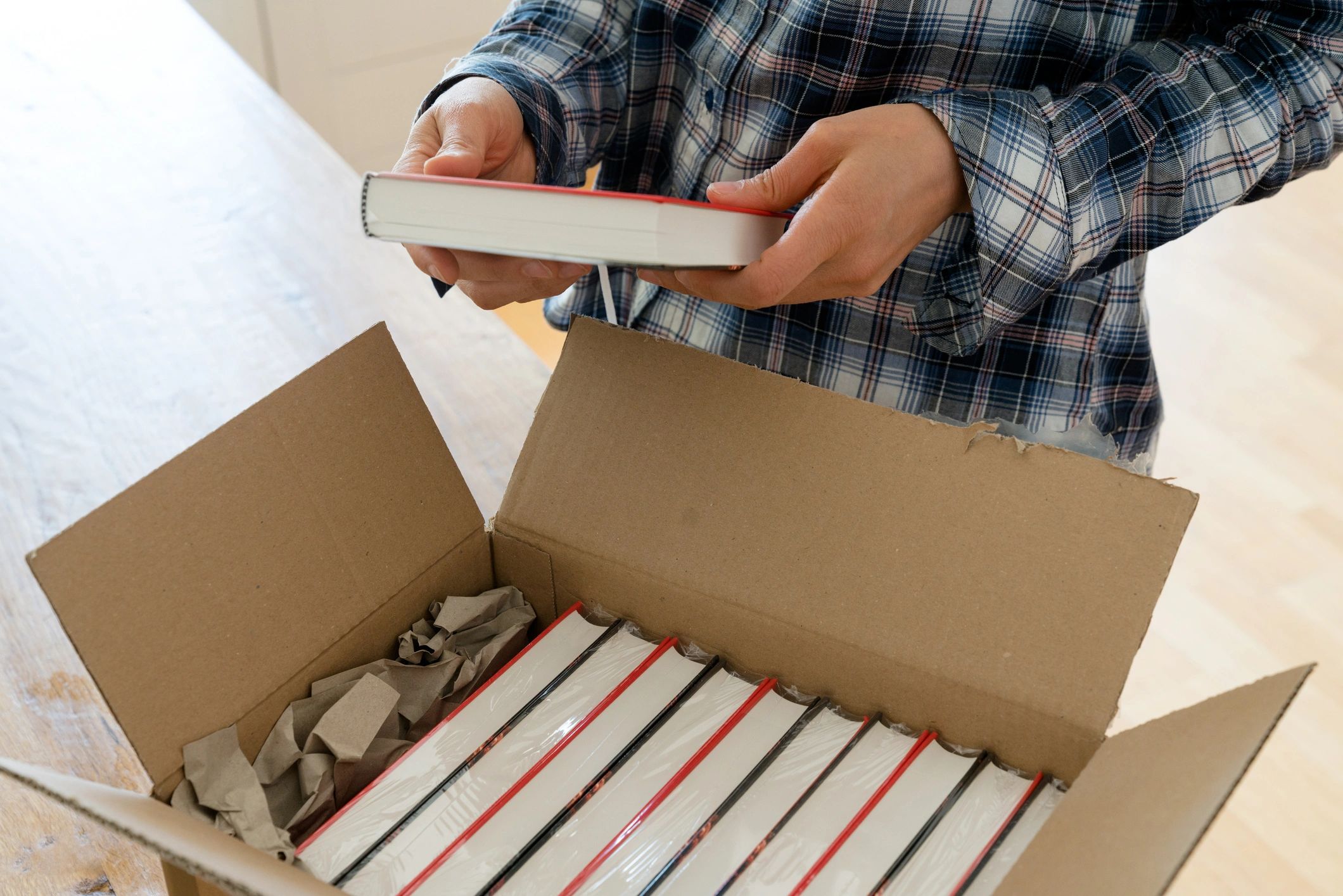 Stack of AI-focused books on a desk
